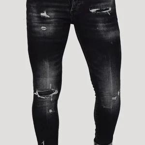 JEANS SKINNY CON STRAPPI