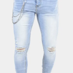 JEANS SKINNY CON STRAPPI E CATENA