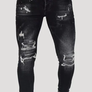 JEANS SKINNY CON STRAPPI E PITTURA