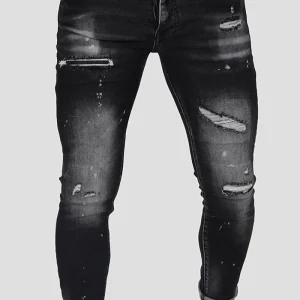 JEANS SKINNY CON STRAPPI E PITTURA