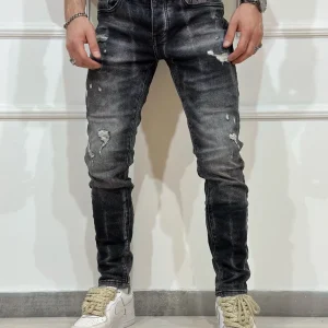 Jeans skinny denim con rotture uomo