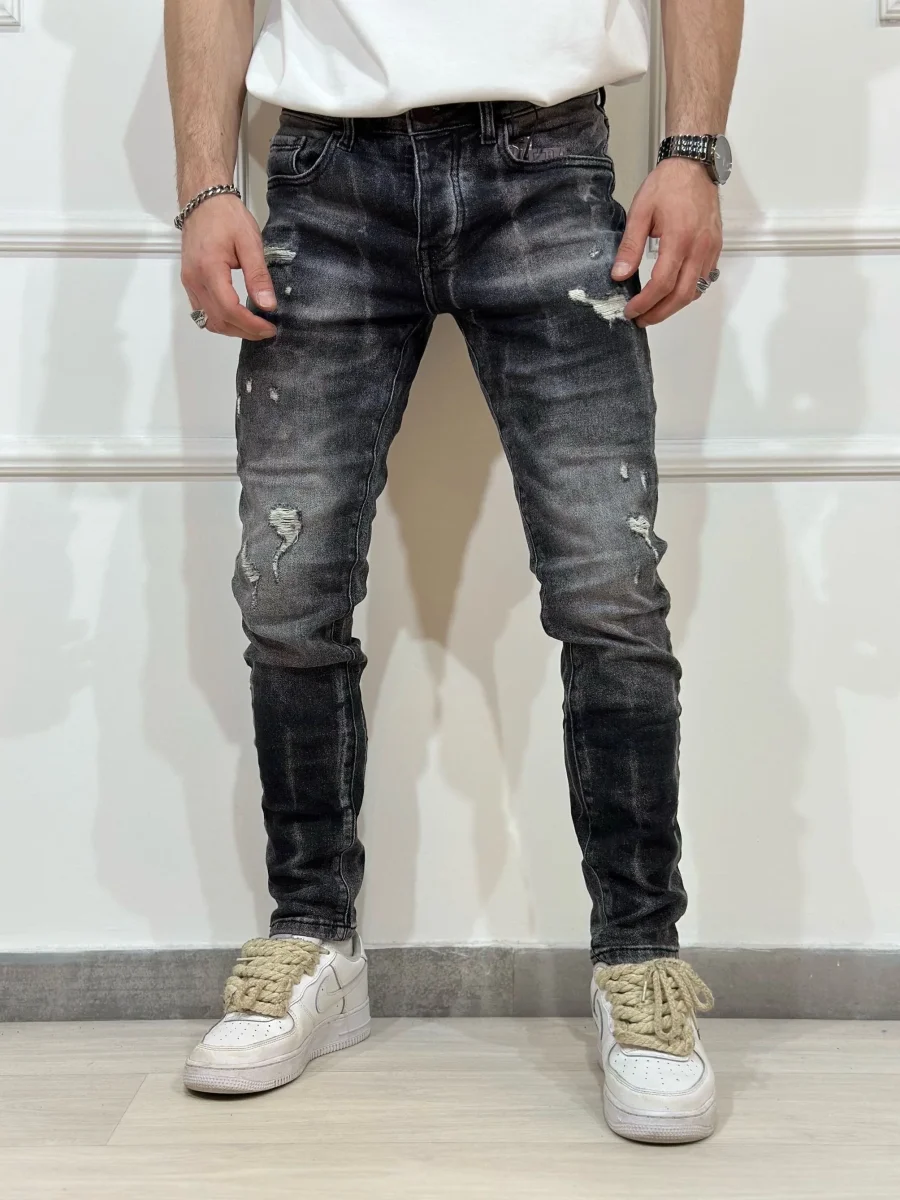 Jeans skinny denim con rotture uomo - immagine 2