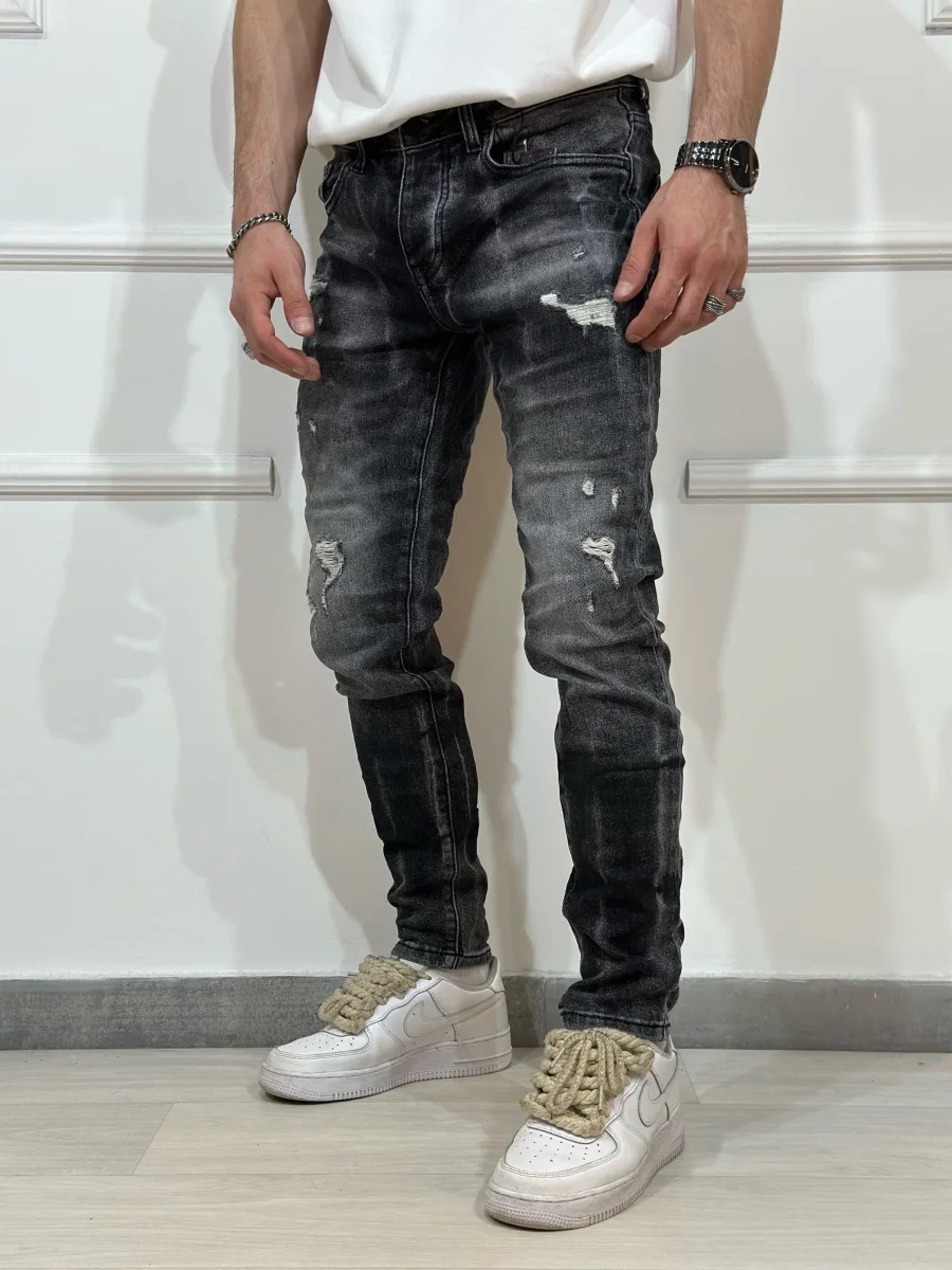 Jeans skinny denim con rotture uomo - immagine 4
