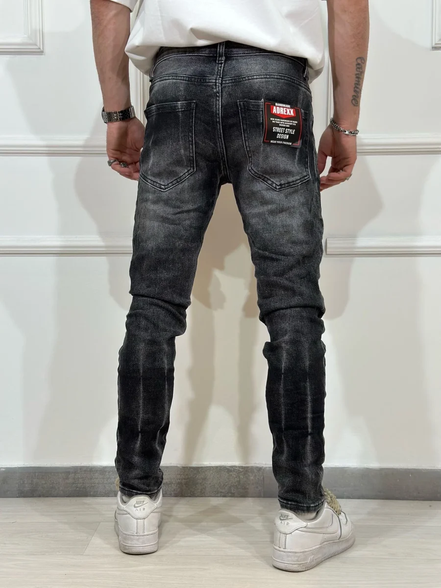 Jeans skinny denim con rotture uomo - immagine 3